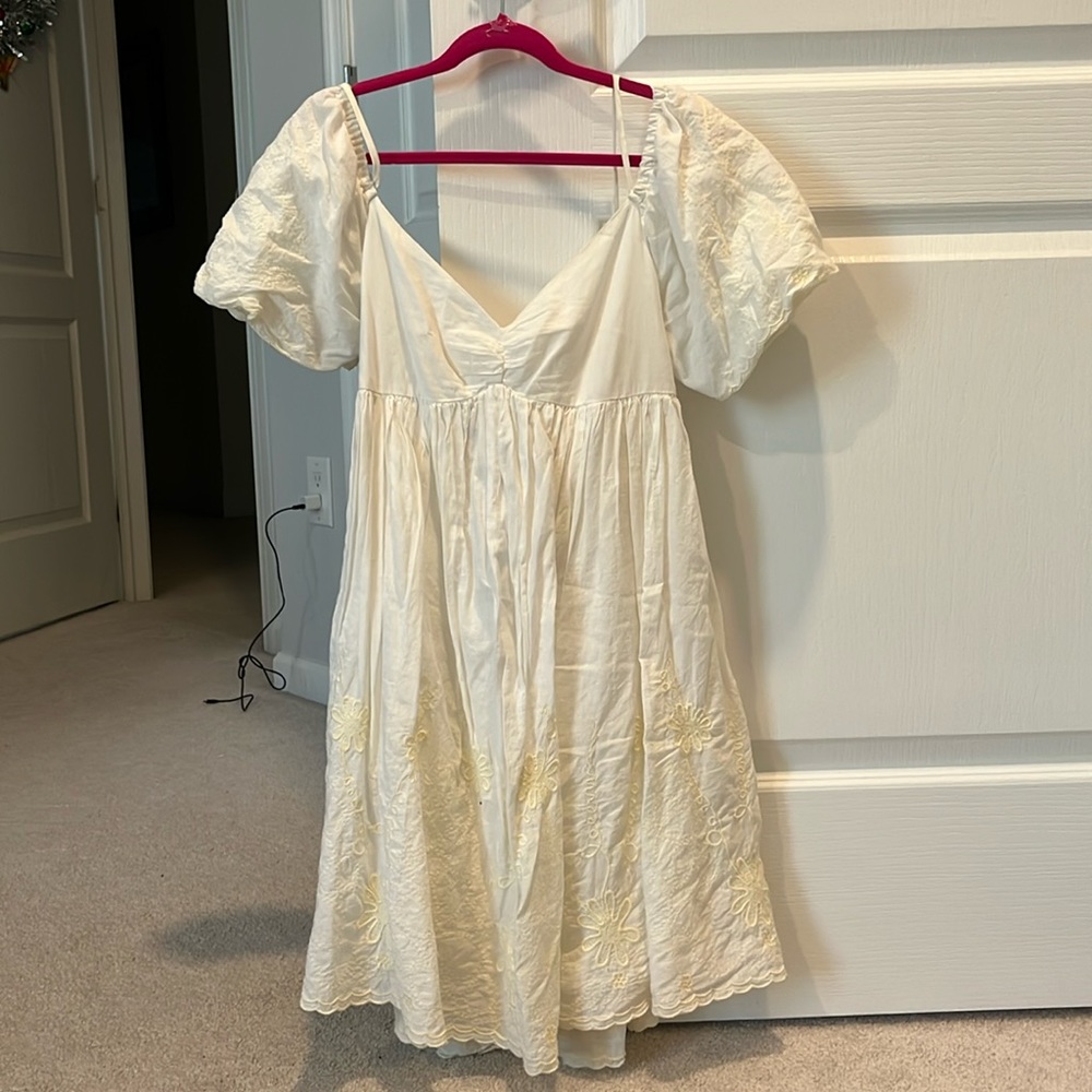 White Babydoll mini dress with floral embroidery bottom